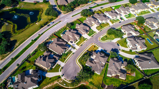 istock Looking down at Modern development in West Round Rock , Texas , USA aerial drone view high above Suburb Neighborhood with Vast amount of Homes 863750248