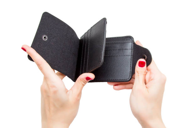 istock Black leather purse in hands on white background 863750462