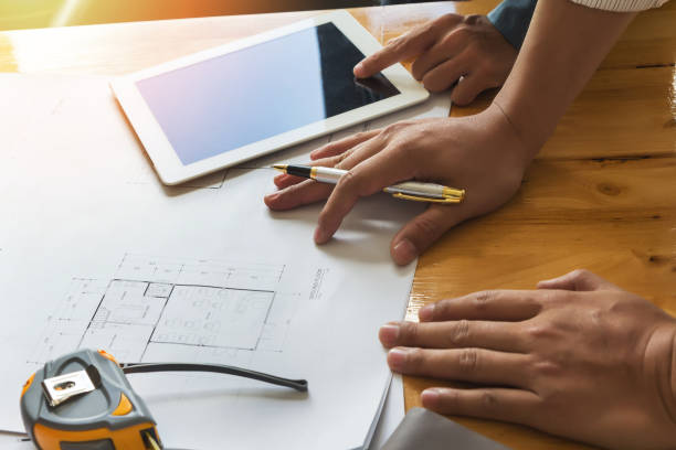 istock Confident team of architect working together in a office. 863759792