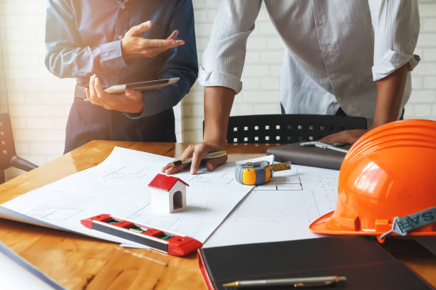 istock Confident team of architect working together in a office. 863759824