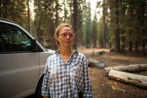 istock Woman Posing By White Van in Oregon Forest 863765684