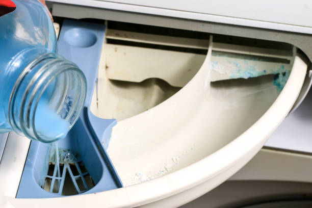 istock Washing machine for clothes and laundry detergent with rinsing liquid. Container for powder and liquid. 863792702