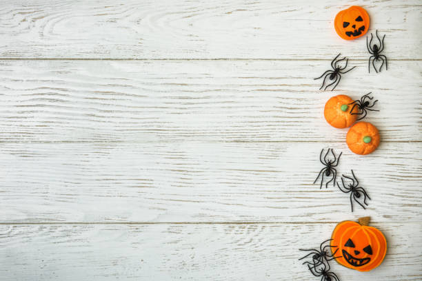 istock Halloween background with pumpkin cookies 863798828