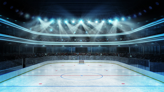Estadio de hockey con espectadores y una pista de hielo vacía photo