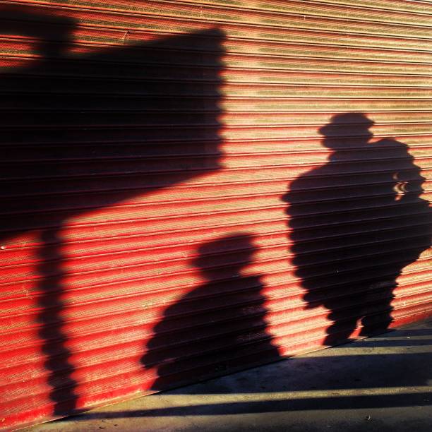 Acton Evening Shadows Evening shadows against a shop front in Acton, West London. Photos by Sam Deards eanling stock pictures, royalty-free photos & images