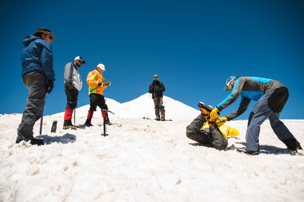 istock Learning to slip properly on a slope or glacier with an ice ax 863823056
