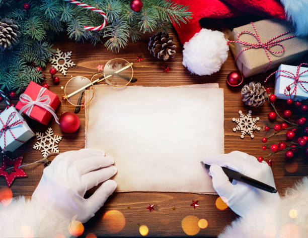 istock Santa Claus Desk With Letter And Christmas Present 863823232