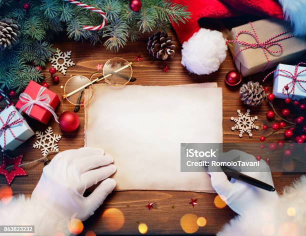 Santa Claus Desk With Letter And Christmas Present Stock Photo - Download Image Now - Santa Claus, Writing - Activity, List