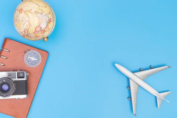 istock Plane toy and travel objects on blue background for travel concept 863823236
