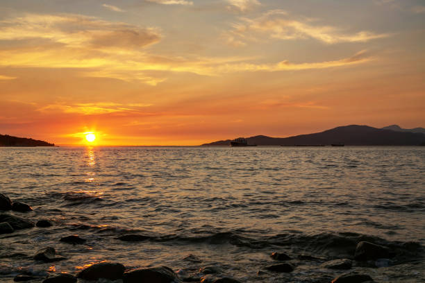 istock sea inlet sunset view, Vancouver, British Columbia, Canada 863829472
