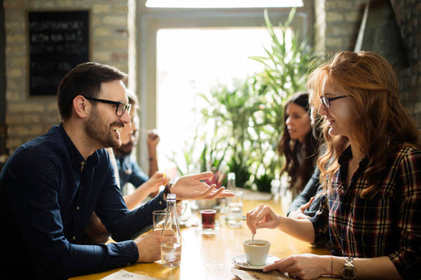 istock Happy colleagues from work socializing in restaurant 863829842