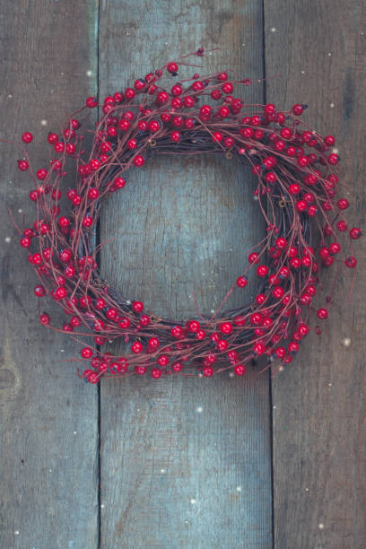 istock Christmas wreath on the wooden background 863830014