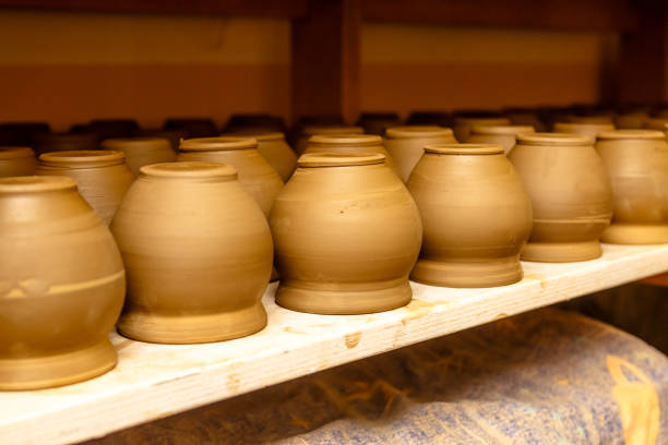 istock A pottery. Pots and jars without a pattern are on the shelves. 863830242