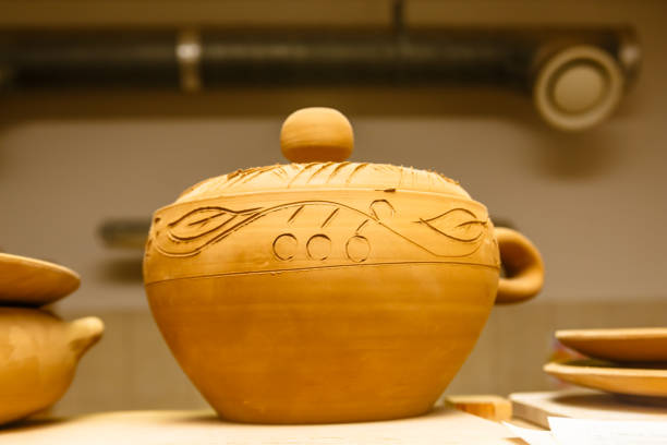 istock A pottery. Pots and jars without a pattern are on the shelves. 863830292