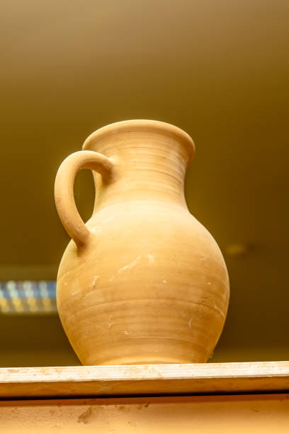 istock A pottery. Pots and jars without a pattern are on the shelves. 863830330