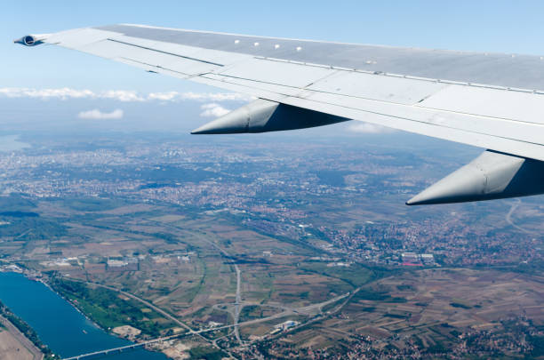 istock Aircraft is flying high above the city. 863839374