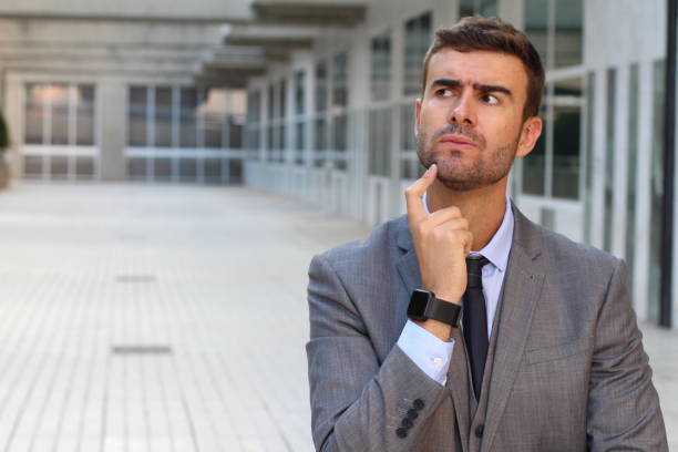 istock Businessman deep in thoughts close up 863839786