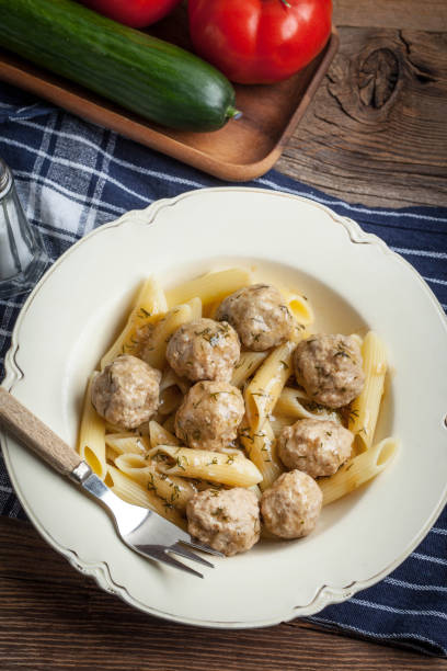 istock Pork meatballs with dill sauce and pasta. 863843152