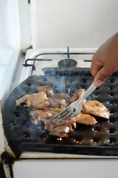 istock Grilled chicken on a barbecue grill on a gas fire 863843206