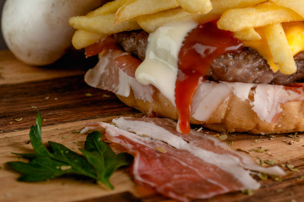 istock Grilled beef burger on a wooden plate 863850870