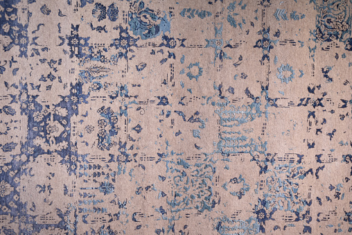 Handmade color woolen carpet background. Grunge texture