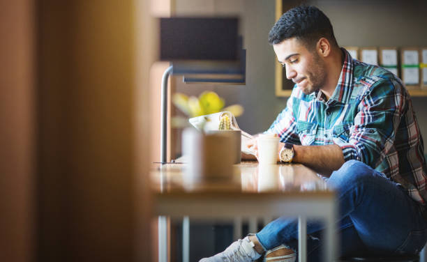 morning coffee at a coffee place. - job search newspaper coffee shop cafe imagens e fotografias de stock