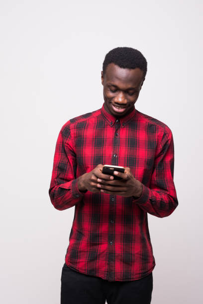 istock African american man with phone on white background 863890552