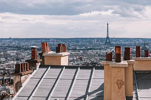 Apartment building rooftops chimneys in Paris, France