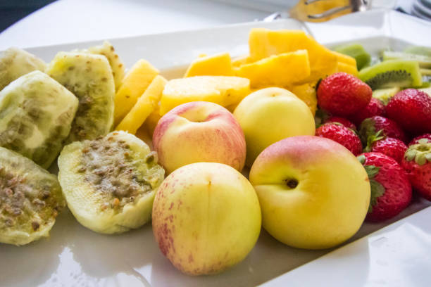 Fresh fruit range Fresh fruit range with peach, kiwi, pineapple, strawberries, ficodindia fico d'india stock pictures, royalty-free photos & images