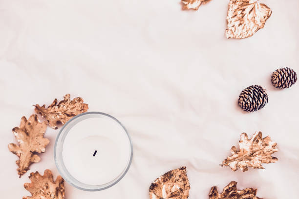 istock Fall leaves and candle  from above on white 863912856