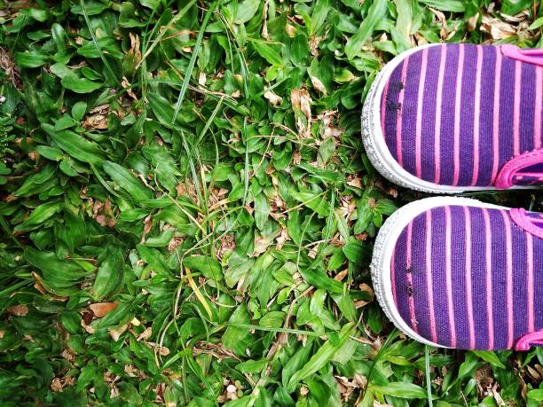 istock Baby Shoes at Fresh Green Grass 863925184