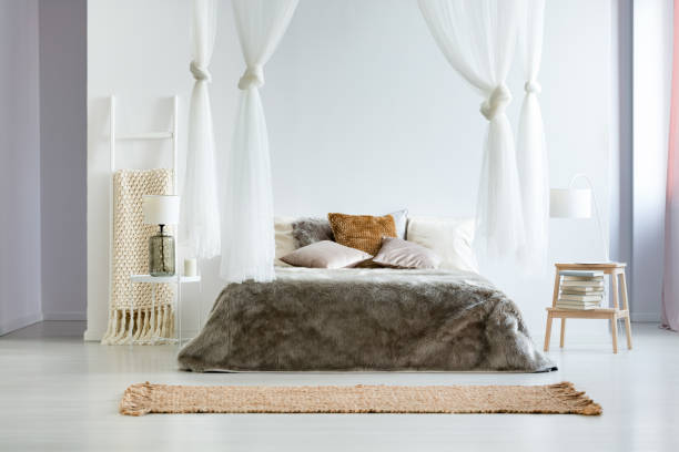 istock King-size bed with fur coverlet 863945734