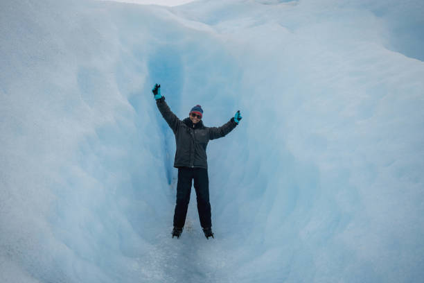 istock Happy woman hiking at a glacier 863948158