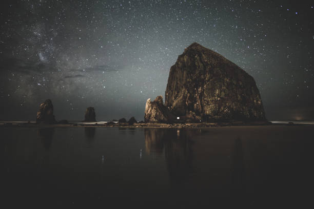 Starry Night Over Coastal Rocks stock photo