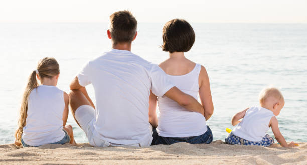 istock Young parents and kids sitting with back forward 863963004