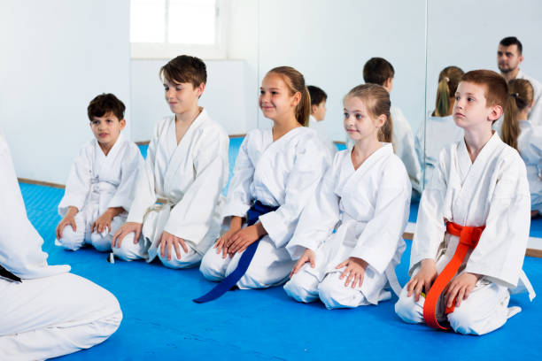 istock Children enjoying their trainings with coach at karate 863963700