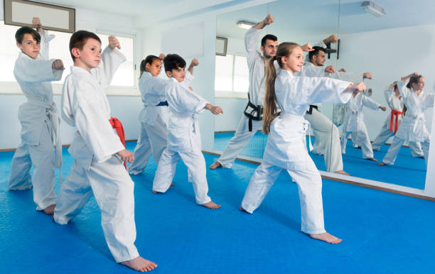 istock Young children are practicing new moves by repeating for the trainer 863963770