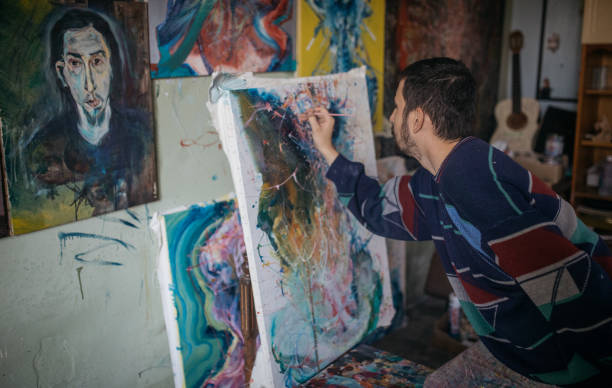 istock Artist painting in studio 863988146