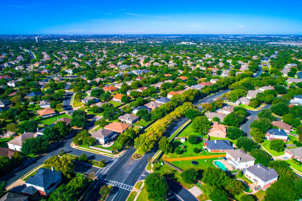 Growing suburban town Round Rock , Texas , USA aerial drone view high above Suburb Neighborhood with Vast amount of Homes stock photo