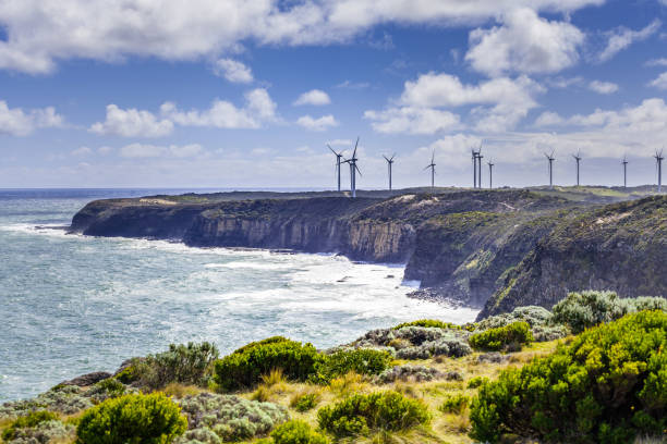 Wind farm built on rugged ocean coastline in Australia stock photo