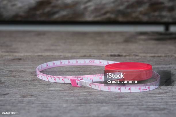 Cute Length Measuring Tape On Wooden Table Stock Photo - Download Image Now  - Accuracy, Arts Culture and Entertainment, Centimeter - iStock