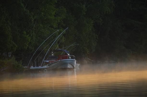 istock Boat on Saranac Lake during the Sunrise 864006388