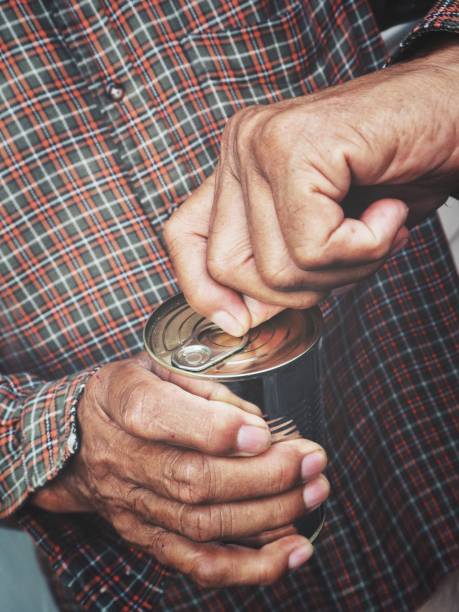 istock Canned food with hands 864009426
