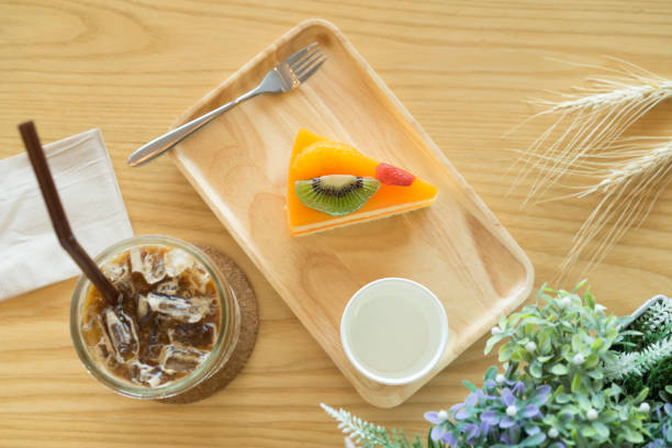 istock Orang cake with ice latte coffee, Top view. 864012830