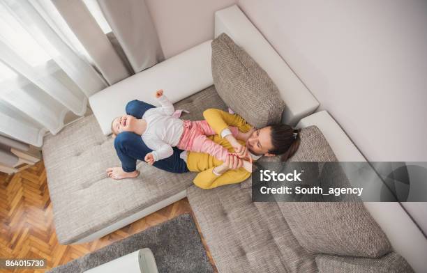 Mother Tickling Daughter Stock Photo - Download Image Now - Baby - Human Age, Tickling, 30-34 Years