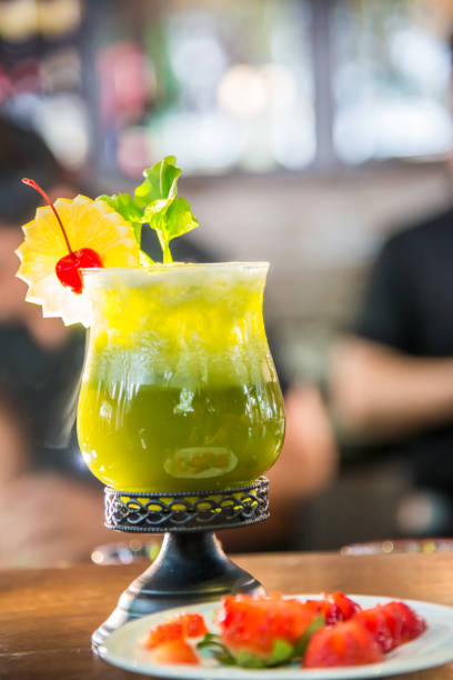 istock Cocktail drink in green favor 864032160
