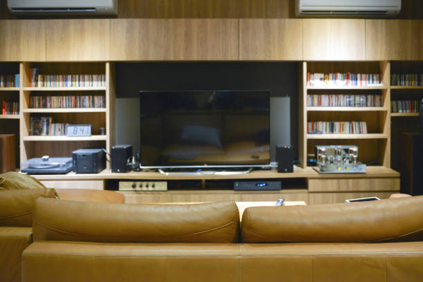istock Sofa in front of TV shelf cabinet, mock up design 864034832