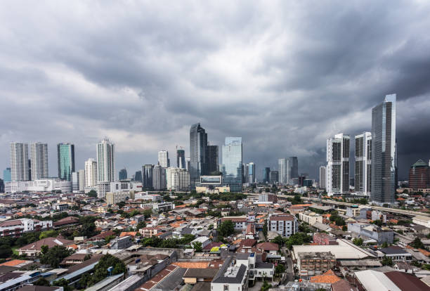 istock Tropical storm over Jakarta skyline in Indonesia 864037586