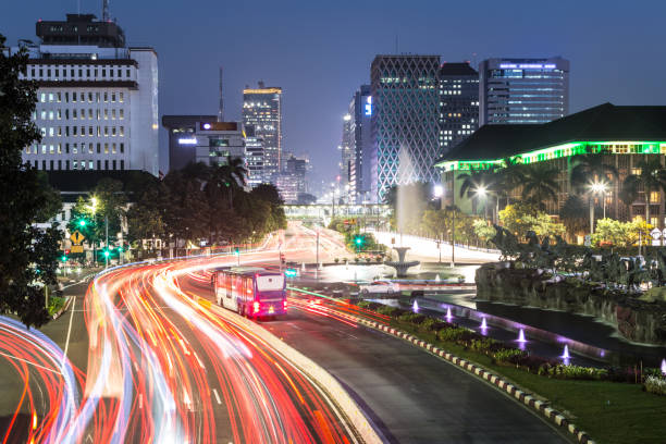 Traffic rushing at night in the streets of Jakarta, Indonesia capital city. stock photo