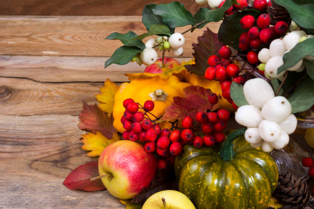 istock Fall background with snowberry, rowan, green and yellow squash 864040312